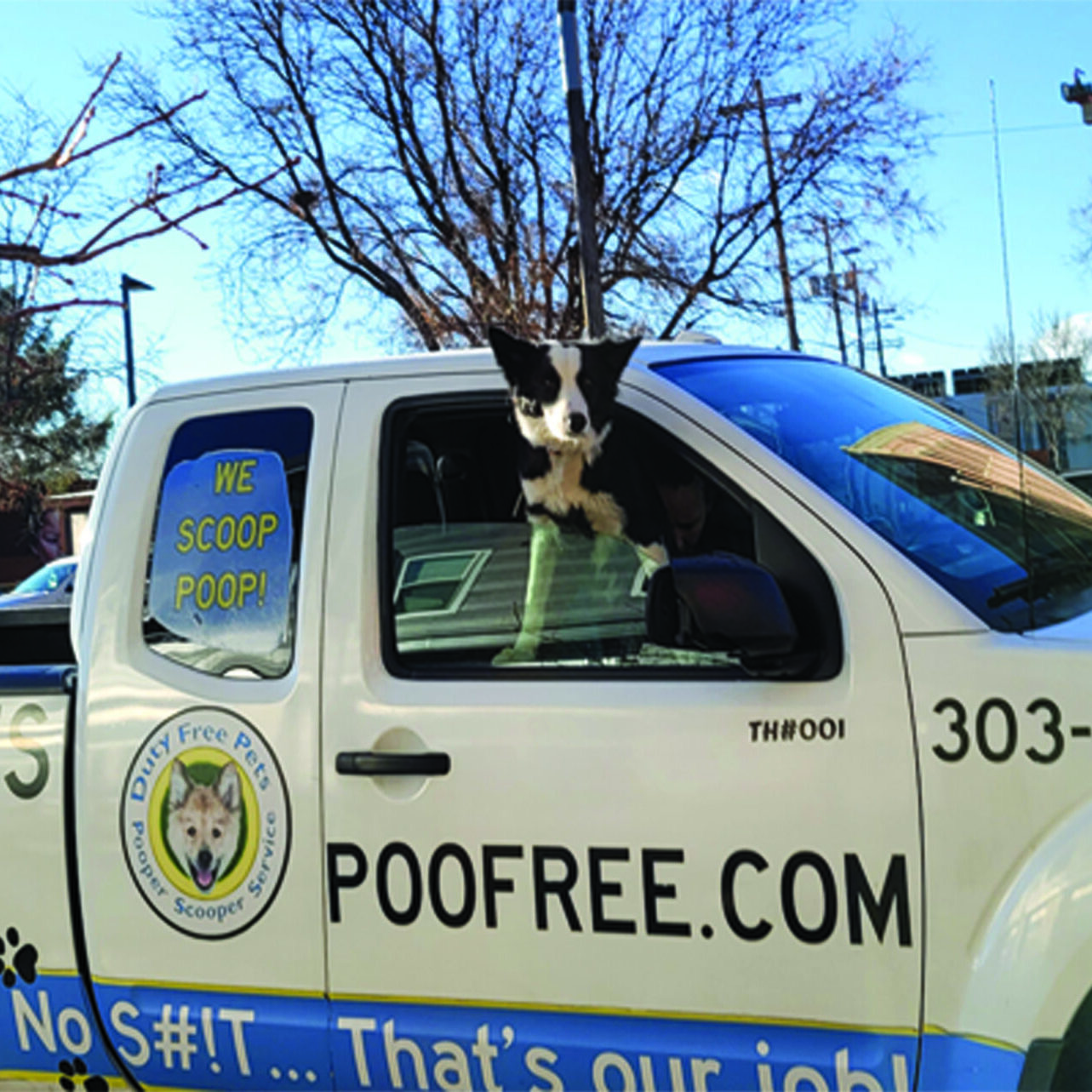 A 'Pooper Scooper' truck with a 'Duty-Free Pets' logo picking up dog poop in Broomfield, Colorado. Specialized equipment is visible for efficient waste removal.